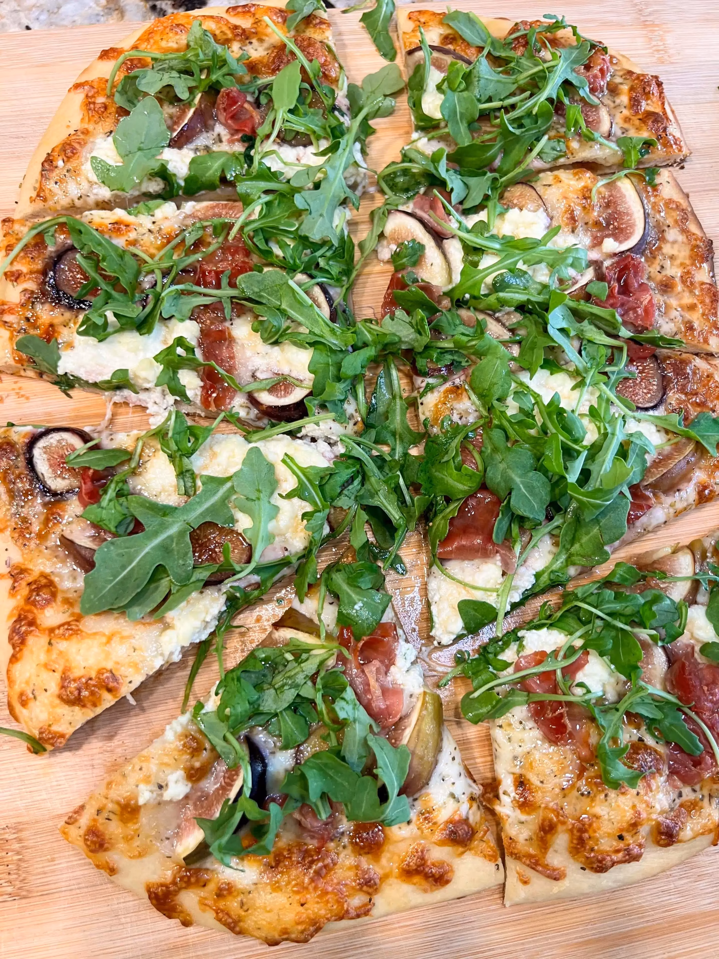 How do you cook pesto arugula pizza?