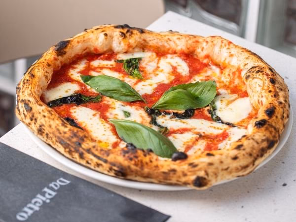 What are people saying about pizza places in Prague?