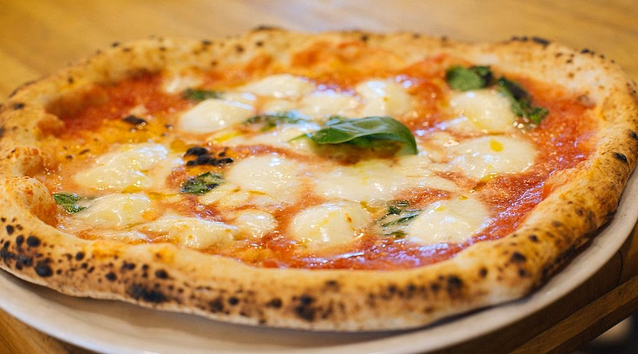Is there a Chilean flag waving on Milan Pizza World?