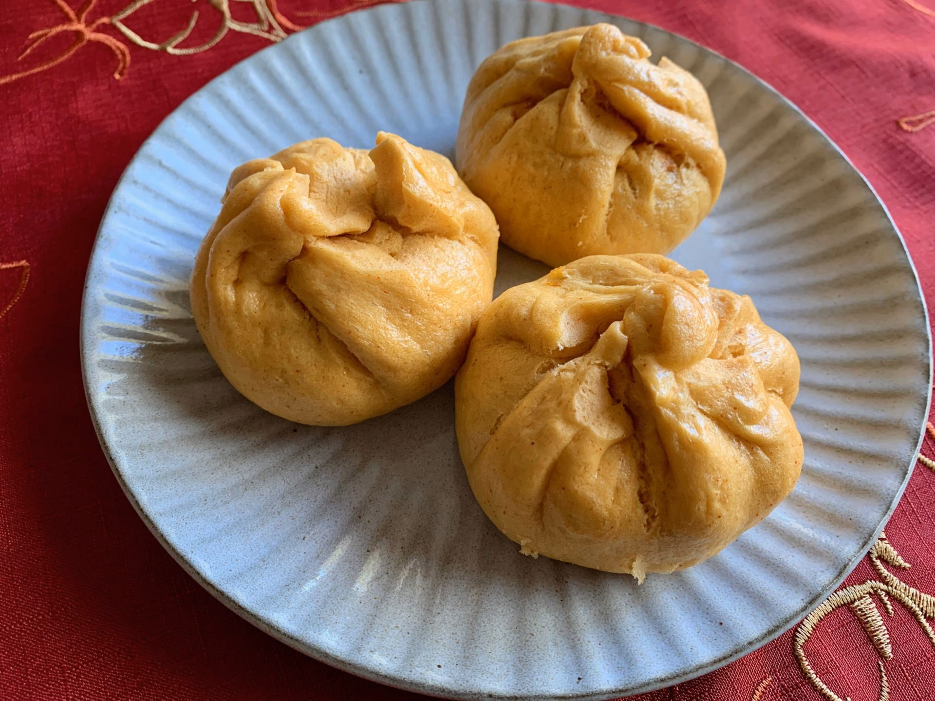 What is a steamed pizza bun?