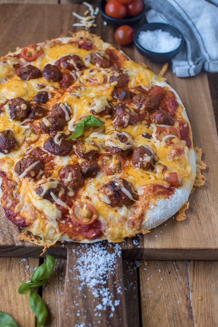 Was sind mögliche Beläge für eine Pizza?