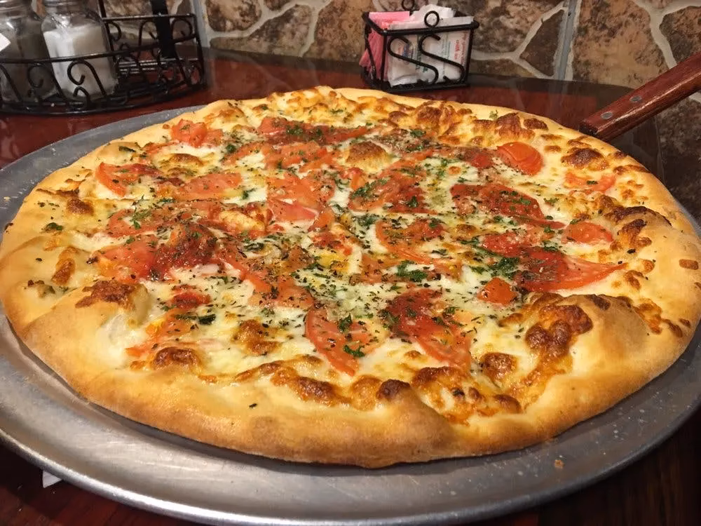 Was bietet Pizzeria Mamma Mia an?