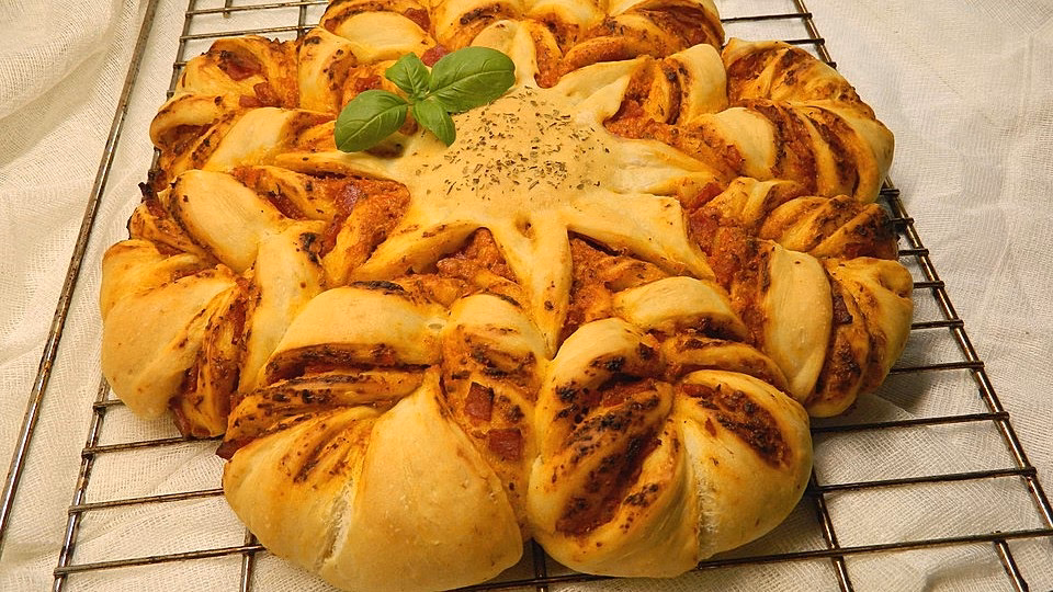 Wie lange muss eine pizzablume im Backofen bleiben?