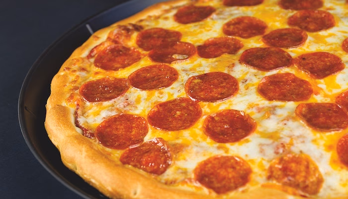 What factors affect pizza dough rise?