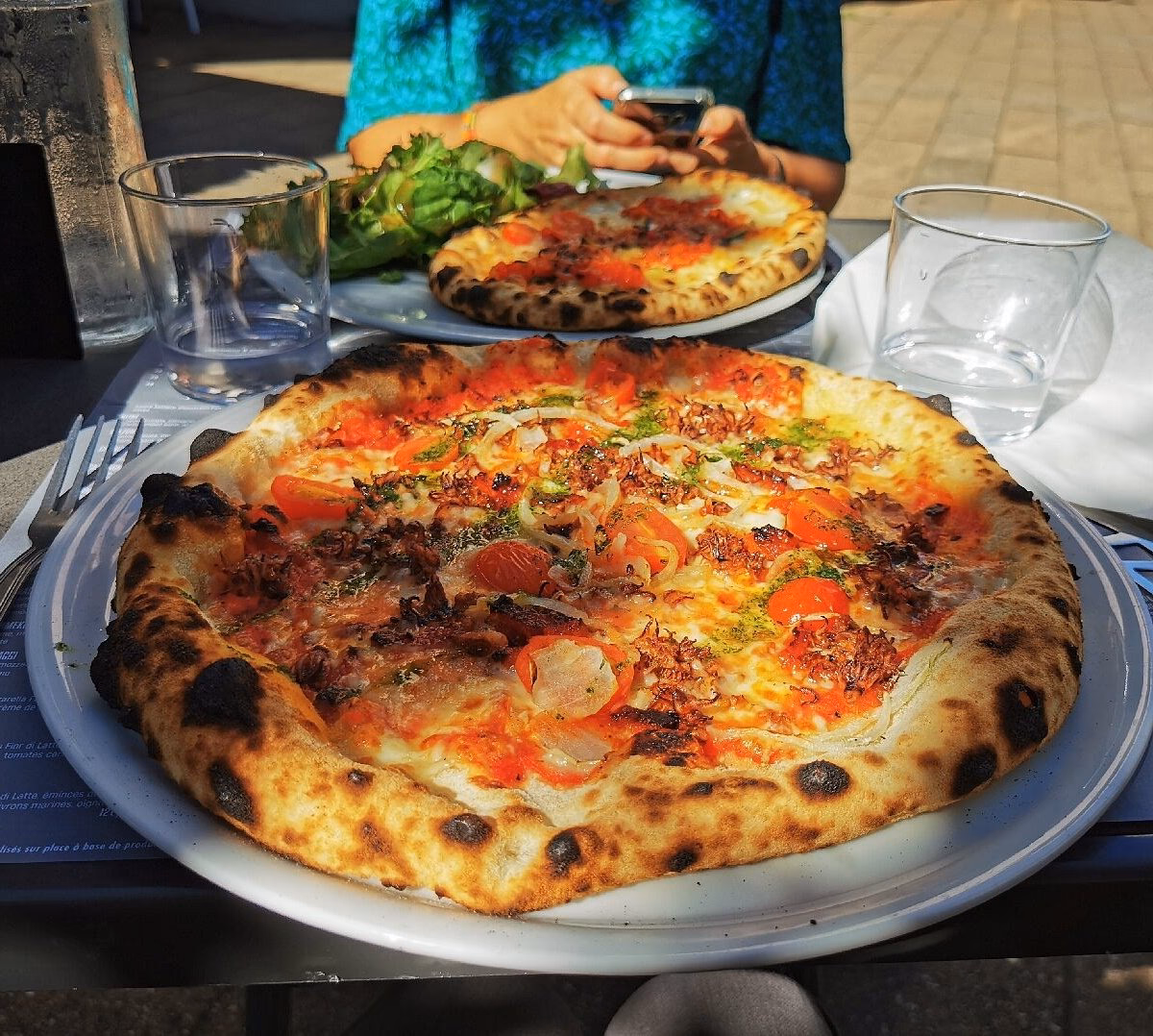 Quelle est la spécialité de la pizzeria di Parma ?