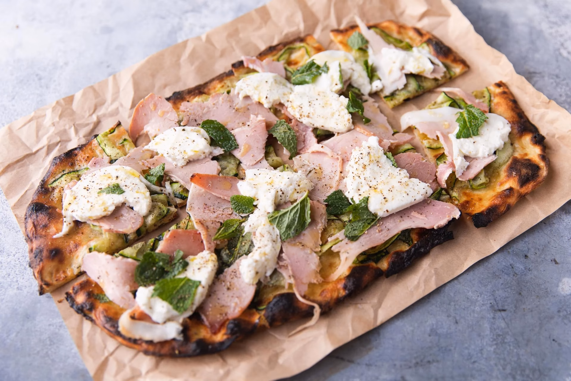 What is the difference between Neapolitan and Roman pizza dough?