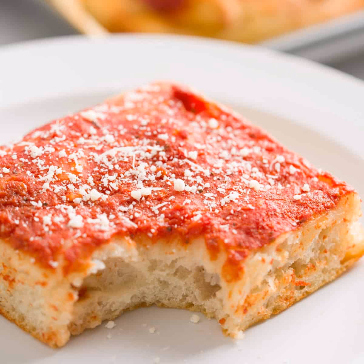 How do you layer a Sicilian pizza?