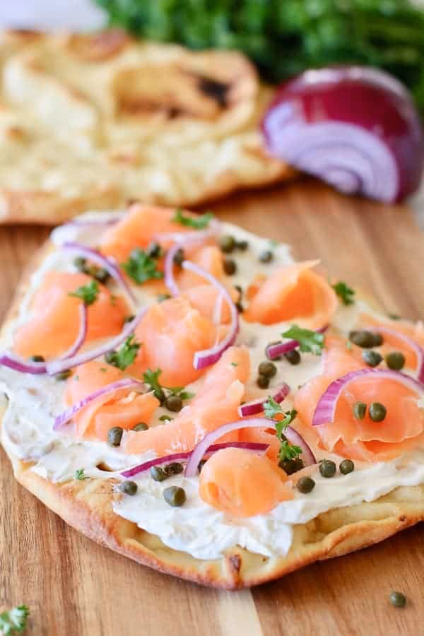 How do you serve a smoked salmon pizza?